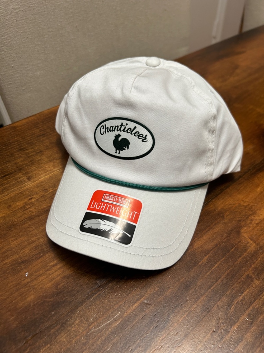 American Needle White Cap with Green Visor and Red Logo Patch